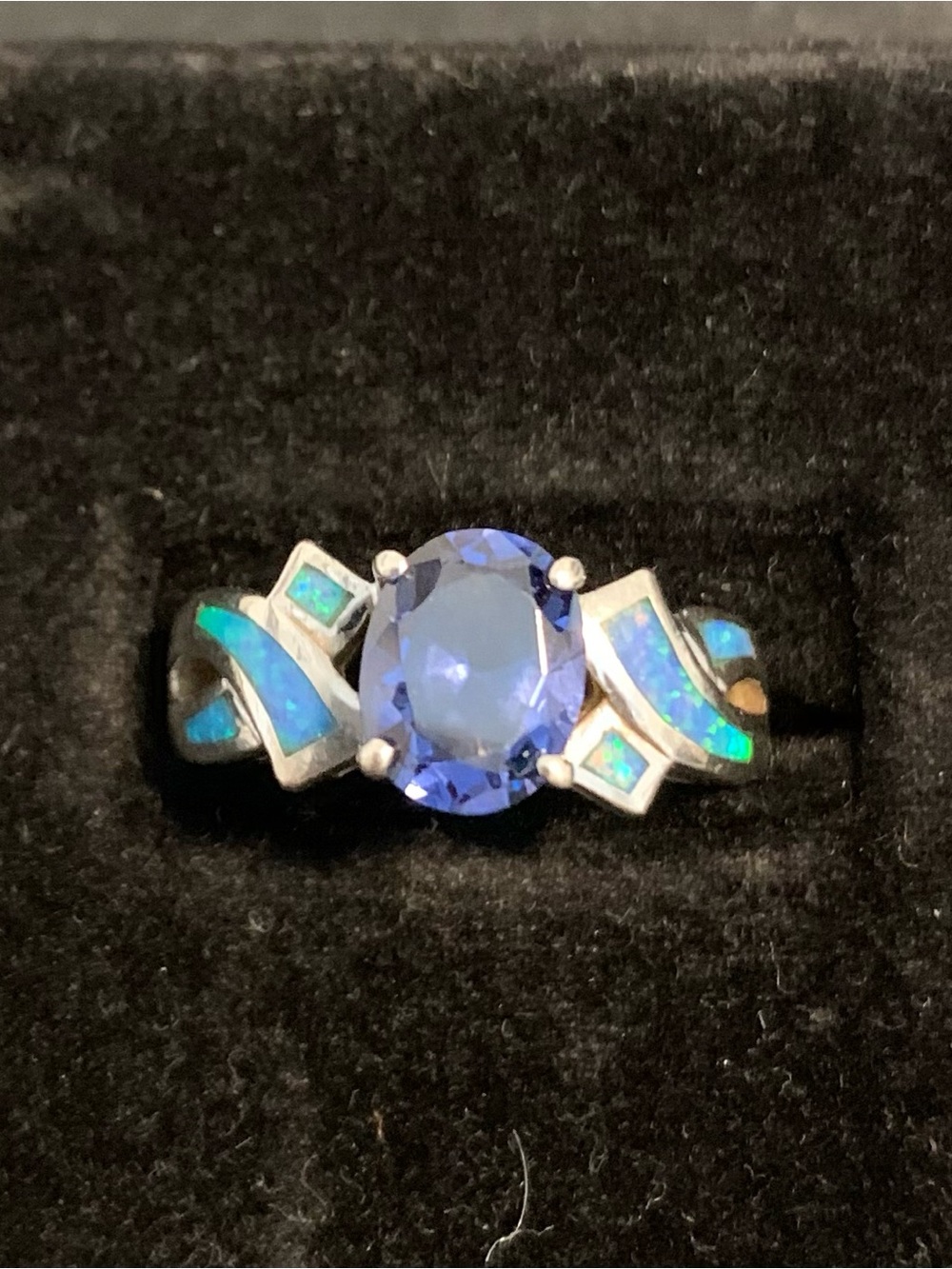 Ring Size 7 - 7.5; inlaid opal surrounds a beautiful tanzanite stone